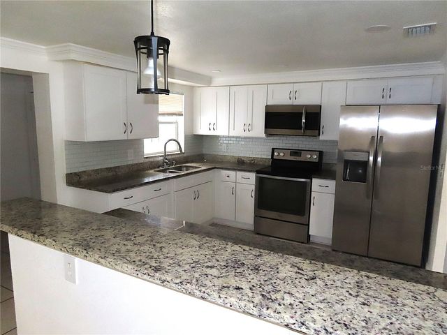 3908 BEECHWOOD BOULEVARD, Tampa, FL 33619