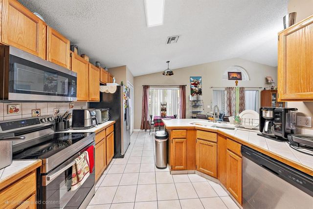 119 Hammocks Drive, Greenacres, FL 33413