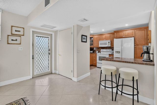 2460 DEER CREEK COUNTRY CLUB Boulevard 206-A, Deerfield Beach, FL 33442
