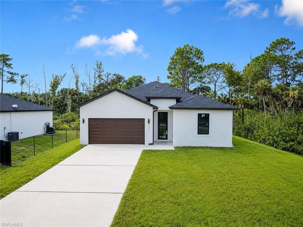 621 GREENBRIAR BLVD, LEHIGH ACRES, FL 33972 — exterior