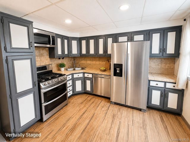 10713 Sutter Avenue, Ozone Park, NY 11417