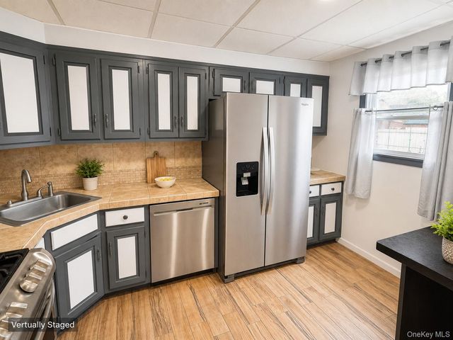 10713 Sutter Avenue, Ozone Park, NY 11417