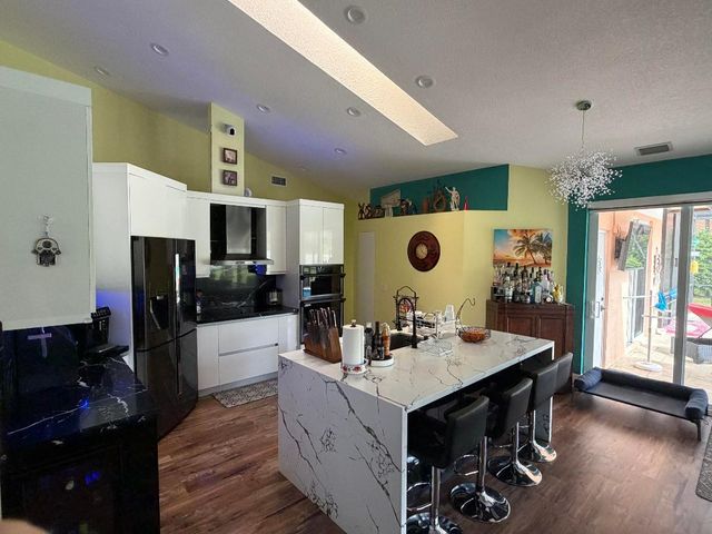 9050 Cypress Hollow Drive, Palm Beach Gardens, FL 33418