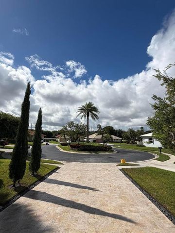 9050 Cypress Hollow Drive, Palm Beach Gardens, FL 33418