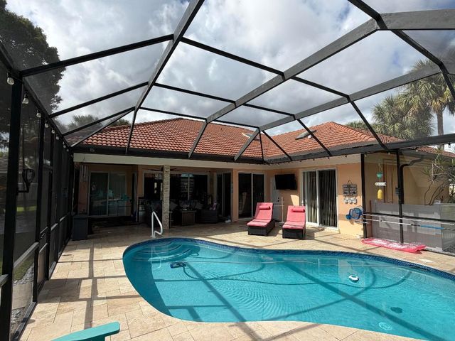 9050 Cypress Hollow Drive, Palm Beach Gardens, FL 33418