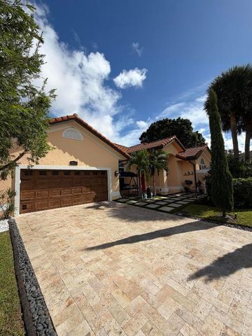 9050 Cypress Hollow Drive, Palm Beach Gardens, FL 33418