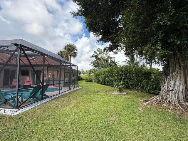 9050 Cypress Hollow Drive, Palm Beach Gardens, FL 33418