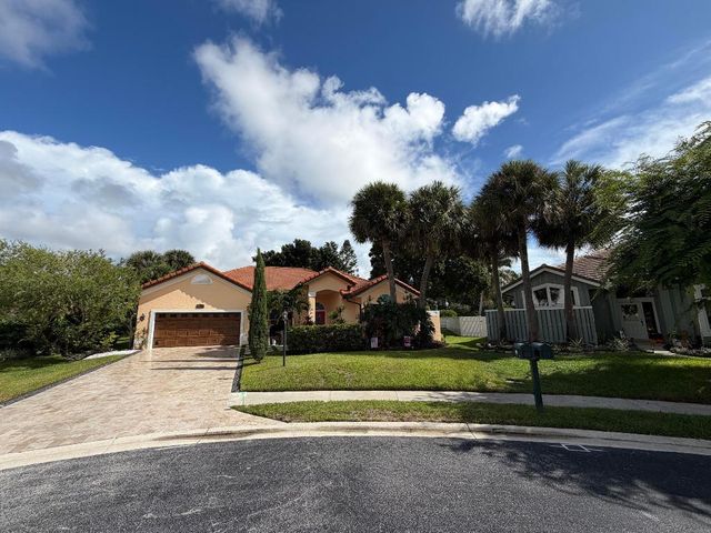 9050 Cypress Hollow Drive, Palm Beach Gardens, FL 33418