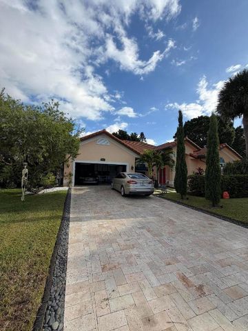 9050 Cypress Hollow Drive, Palm Beach Gardens, FL 33418