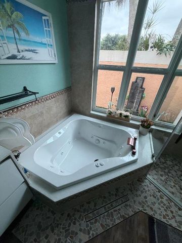 9050 Cypress Hollow Drive, Palm Beach Gardens, FL 33418