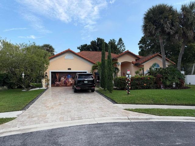 9050 Cypress Hollow Drive, Palm Beach Gardens, FL 33418