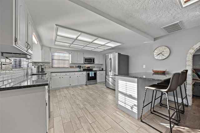 5702 RIDDLE ROAD, Holiday, FL 34690