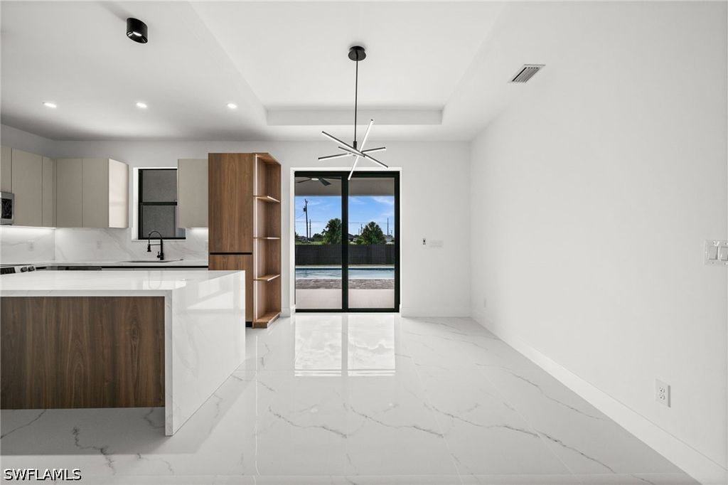 Image 10 of property listing at 409 NW 25TH PL, Cape Coral, FL 33993