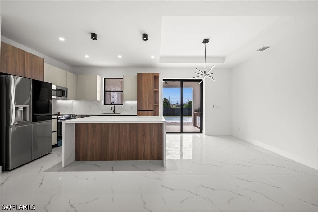 Image 11 of property listing at 409 NW 25TH PL, Cape Coral, FL 33993