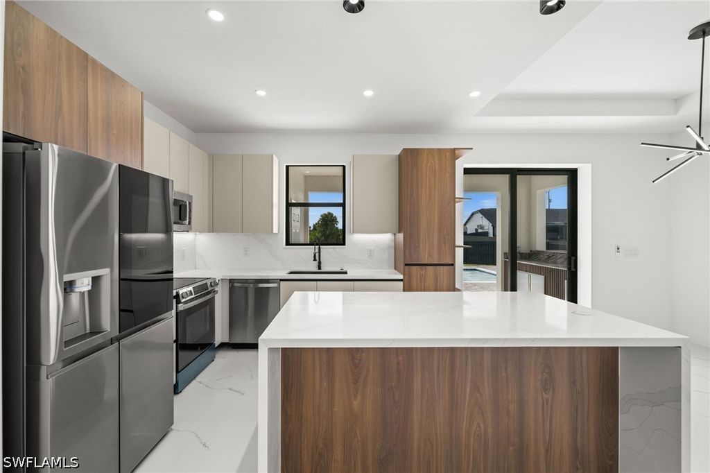Image 16 of property listing at 409 NW 25TH PL, Cape Coral, FL 33993