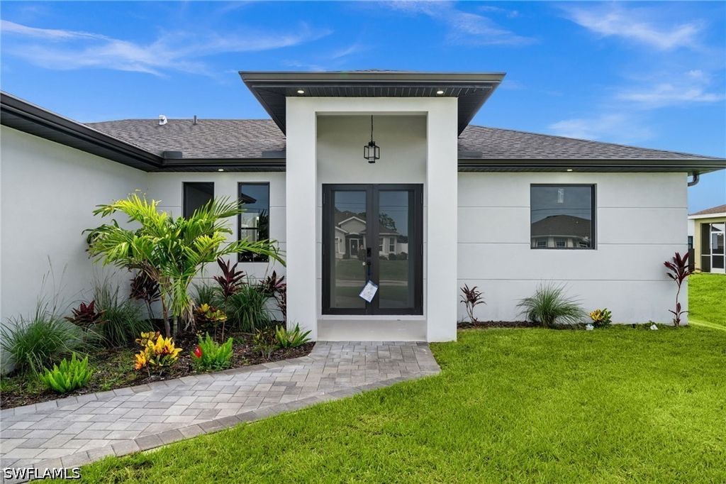 Image 2 of property listing at 409 NW 25TH PL, Cape Coral, FL 33993