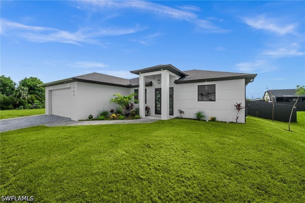 Image 3 of property listing at 409 NW 25TH PL, Cape Coral, FL 33993