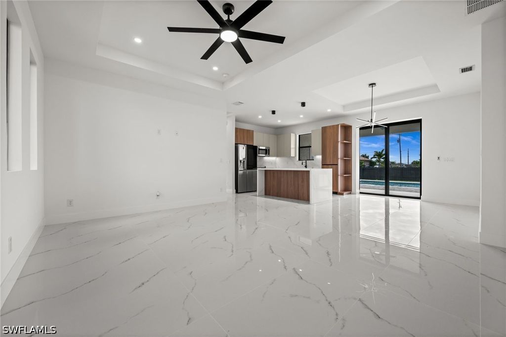 Image 6 of property listing at 409 NW 25TH PL, Cape Coral, FL 33993