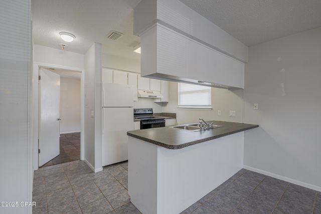 7813 N Lagoon Drive 4H, Panama City Beach, FL 32408