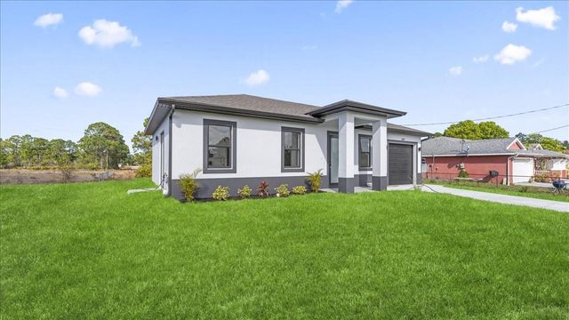 1143 BARFIELD STREET E, Lehigh Acres, FL 33974