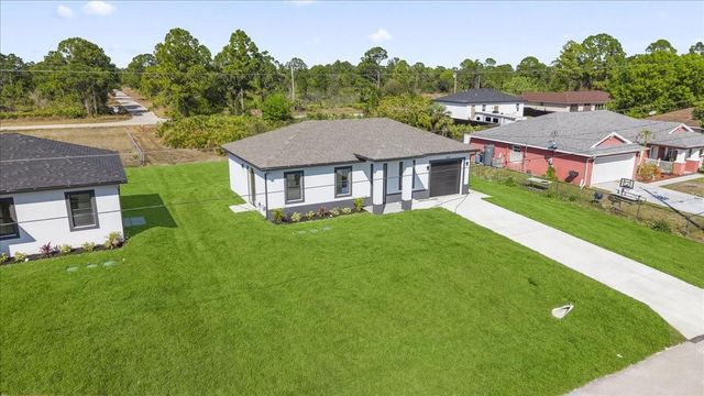 1143 BARFIELD STREET E, Lehigh Acres, FL 33974