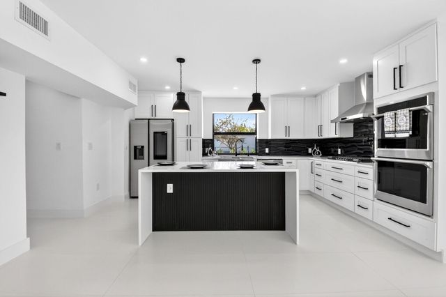 1410 Beta Court N, Lake Clarke Shores, FL 33406