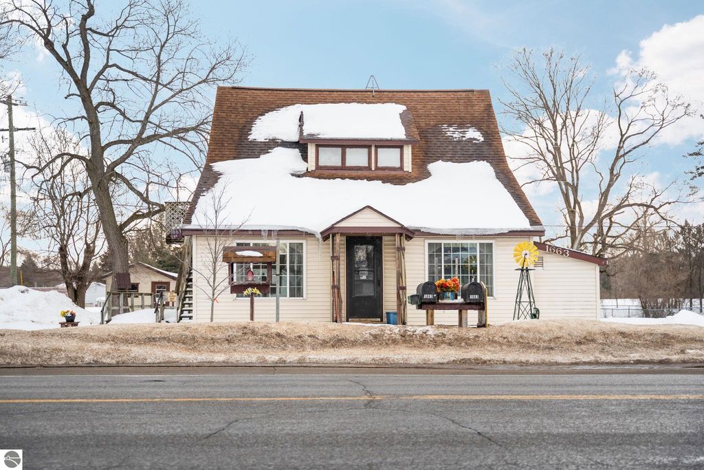 Image 2 of property listing at 1663 County Road 633, Grawn, MI 49637