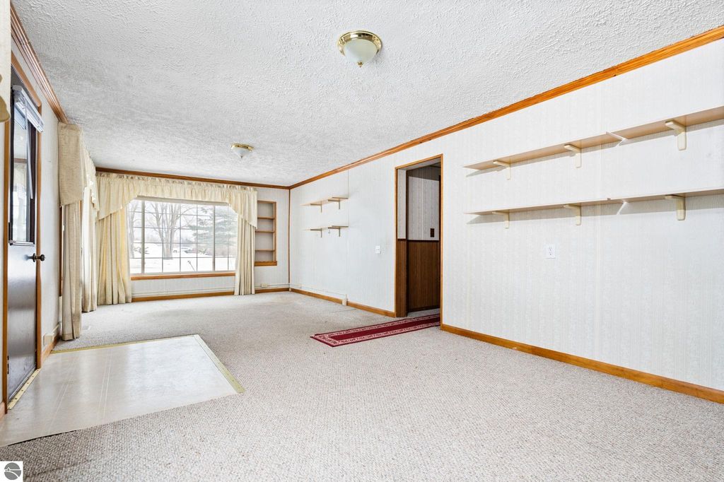 Image 3 of property listing at 1663 County Road 633, Grawn, MI 49637