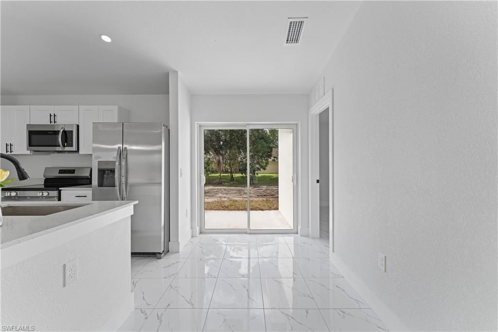 909 Grant BLVD, LEHIGH ACRES, FL 33974 — photo 4