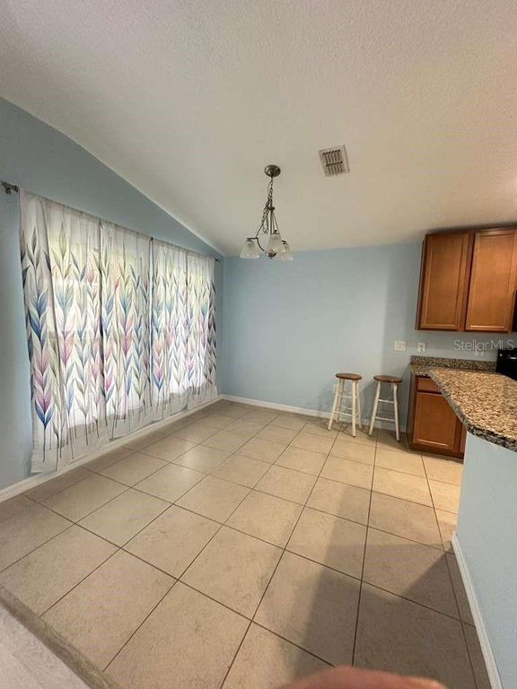 Image 4 of property listing at 10816 CABBAGE TREE LOOP, Orlando, FL 32825