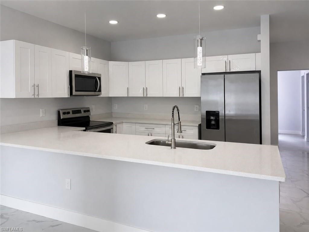 2405/2407 Xelda AVE N, LEHIGH ACRES, FL 33971 — exterior