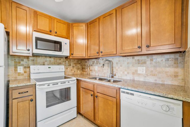 400 VILLAGE GREEN Circle W 102, Palm Springs, FL 33461
