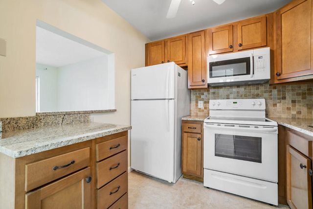 400 VILLAGE GREEN Circle W 102, Palm Springs, FL 33461