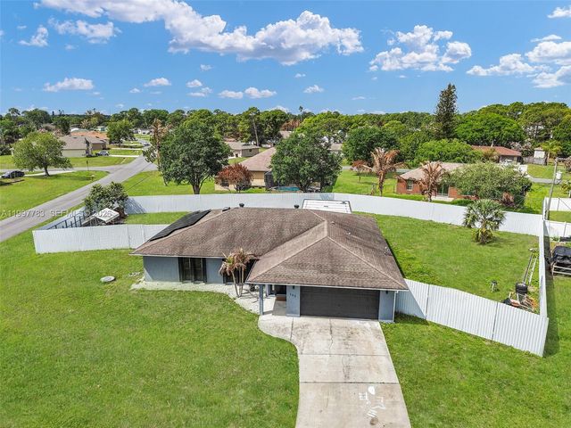 702 NW Orchid St, Port St. Lucie, FL 34983