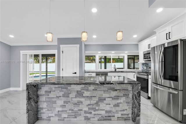 702 NW Orchid St, Port St. Lucie, FL 34983