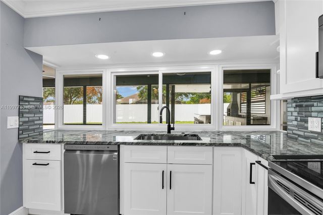 702 NW Orchid St, Port St. Lucie, FL 34983