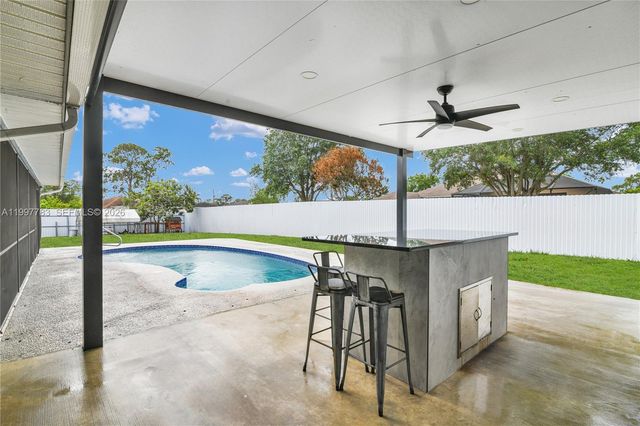 702 NW Orchid St, Port St. Lucie, FL 34983