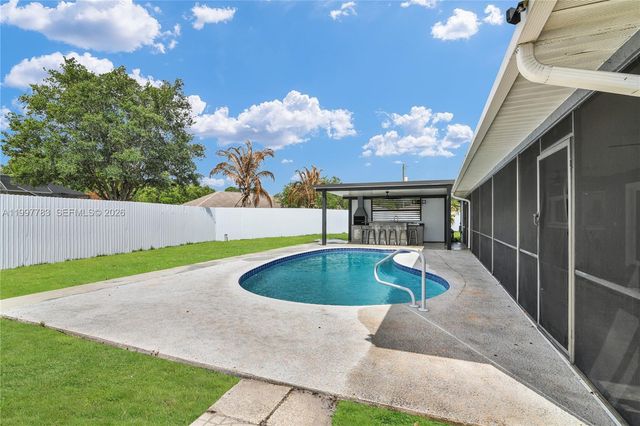 702 NW Orchid St, Port St. Lucie, FL 34983