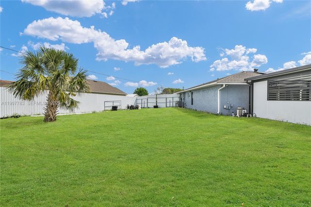 702 NW Orchid St, Port St. Lucie, FL 34983