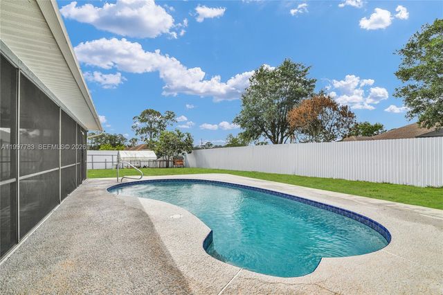 702 NW Orchid St, Port St. Lucie, FL 34983