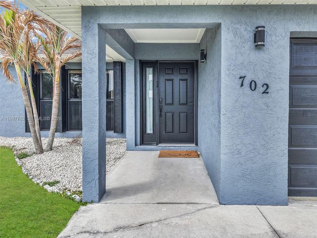 702 NW Orchid St, Port St. Lucie, FL 34983