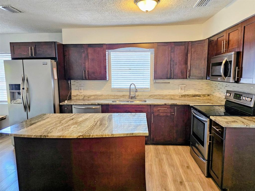 Image 3 of property listing at 3128 W VARN AVENUE, Tampa, FL 33611