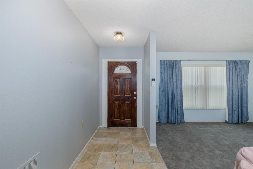 Image 3 of property listing at 8240 WINDING WOOD DRIVE, Port Richey, FL 34668