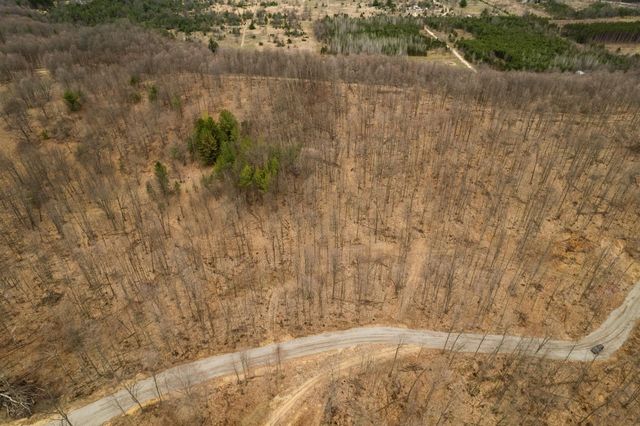 H Retreats Way, Rapid City, MI 49676