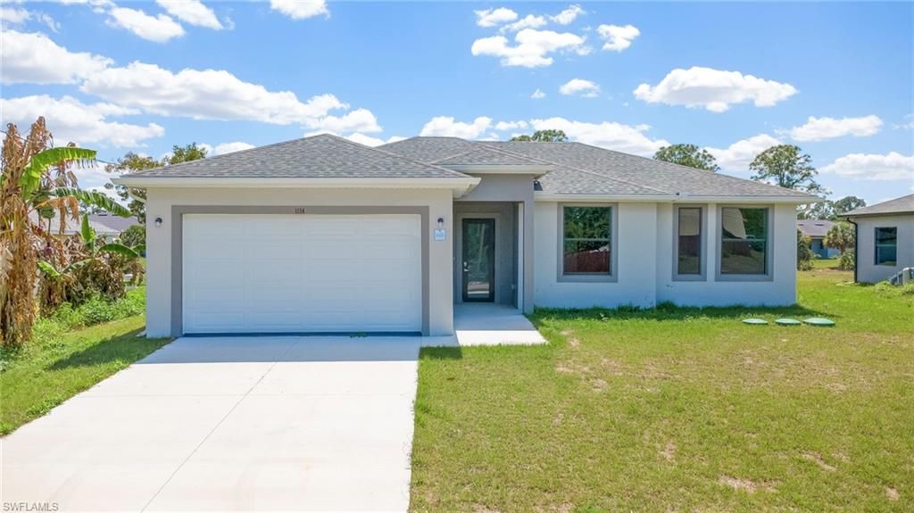 1134 Cumming ST E, LEHIGH ACRES, FL 33974 — exterior