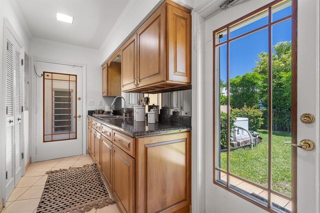 57 Cayuga Road, Sea Ranch Lakes, FL 33308