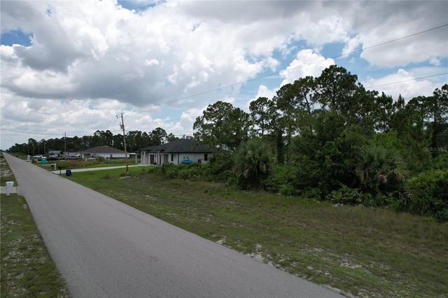 1056 JAGUAR BOULEVARD, Lehigh Acres, FL 33974