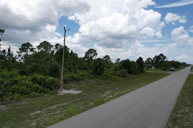 1056 JAGUAR BOULEVARD, Lehigh Acres, FL 33974