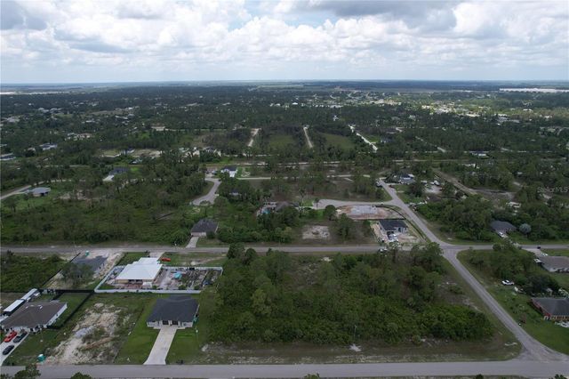 1056 JAGUAR BOULEVARD, Lehigh Acres, FL 33974