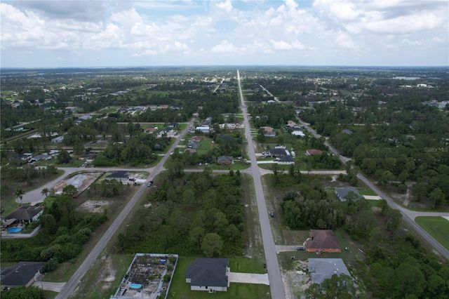 1056 JAGUAR BOULEVARD, Lehigh Acres, FL 33974
